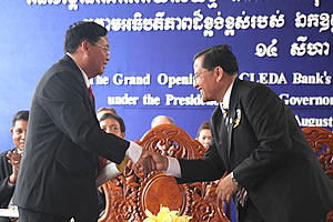 H.E. CHEANG Orm, Governor of Svay Rieng Province, shaking hands with Mr. IN Channy, President & CEO of ACLEDA Bank