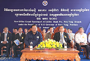 Front row (left to right): H.E. UNG Samy, the Governor of Prey Veng Province and Mr. IN Channy, President & CEO of ACLEDA Bank Plc.