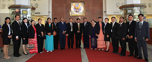 Management of ACLEDA Bank and ACLEDA Training Center taking photo with delegates at ACLEDA Bank’s headquarters banking hall