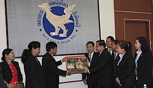 Mr. Nay Aye, Deputy Governor of Central Bank of Myanmar, gives a gift to Mr. In Channy, President & CEO of ACLEDA Bank